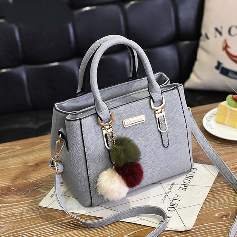 Image of Luxury Handbag with decorative fur